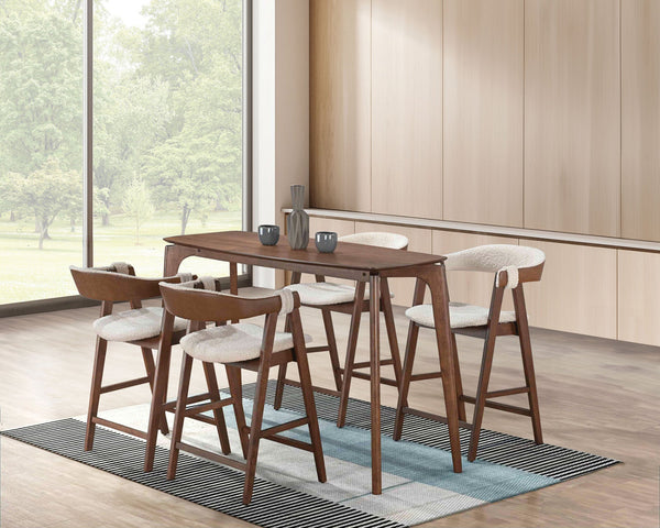 Wooden bar table with four stools in a modern kitchen setting
