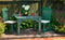 Green outdoor table with chairs and drinks on a patio 